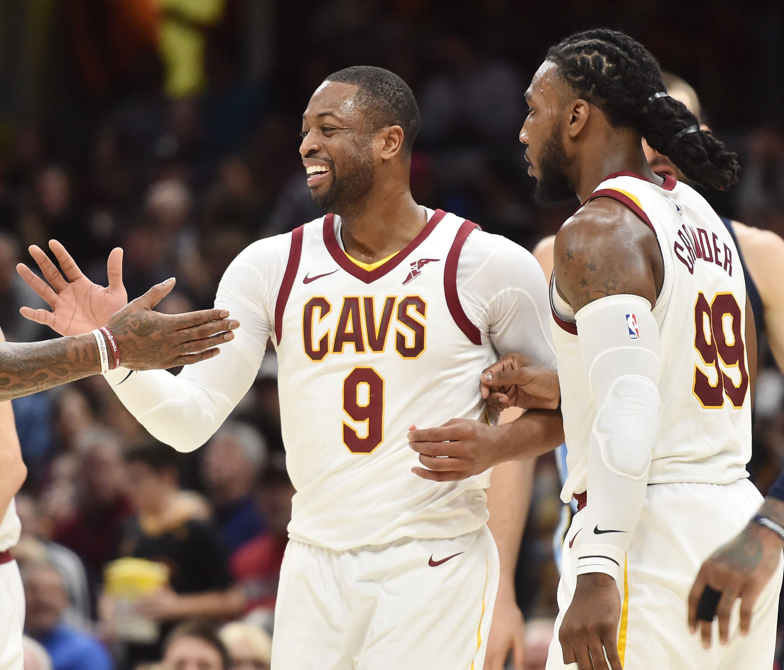 Cleveland Cavaliers guard Dwyane Wade (9) and guard JR Smith (5) celebrate during the second half against the Memphis Grizzlies at Quicken Loans Arena.