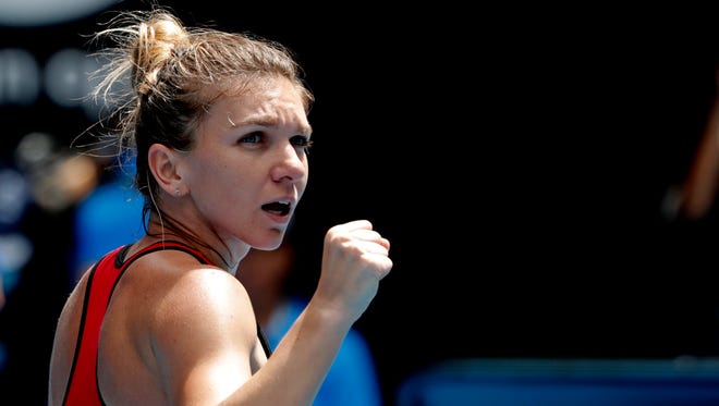 Simona Halep celebrates after defeating Lauren Davis in their third round match at the Australian Open on Saturday.