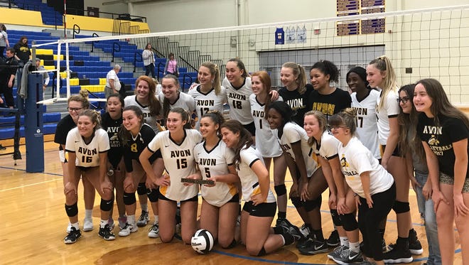 Avon's volleyball team poses after winning Saturday's Greenfield-Central regional.