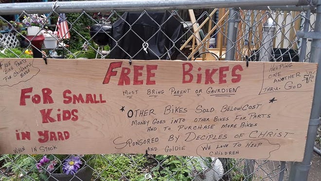 A sign outside Lee Golden's backyard in the Jacobsville neighborhood of Evansville offers free bicycles for children.