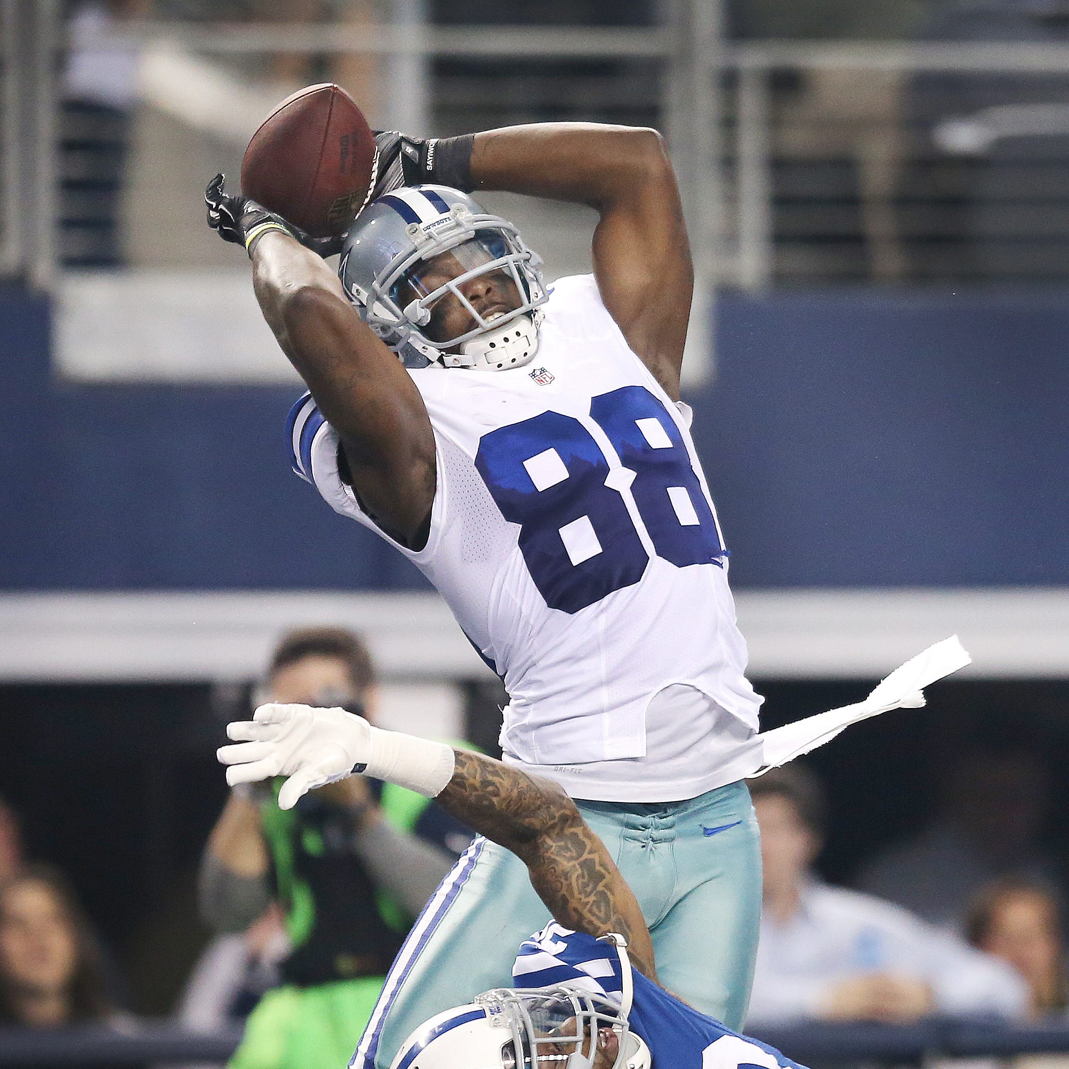 Dallas Cowboys wide receiver Dez Bryant pulls in a first quarter touchdown pass over top of Indianapolis Colts cornerback Greg Toler. Indianapolis traveled to Dallas for an afternoon game Sunday, December 21, 2014.