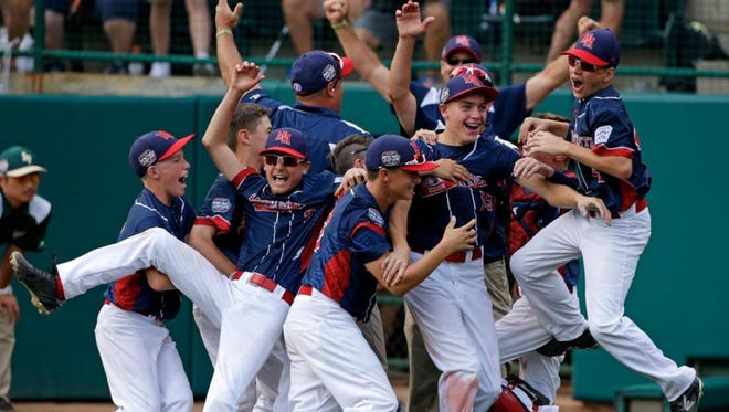 Players from Maine-Edwell (N.Y.) celebrate their 2016 win over South Korea in the championship game of the Little League World Series in South Williamsport, Pa.