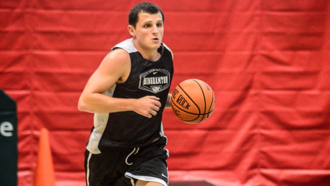 Rinaldi dribbles a ball during a summer practice in the Events Center in July 2014.