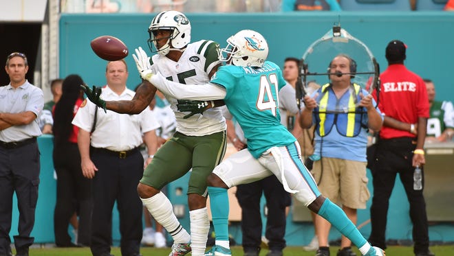 Miami Dolphins middle linebacker Kiko Alonso (47) is called for pass interference on New York Jets wide receiver Brandon Marshall (15) during the second half at Hard Rock Stadium. The Miami Dolphins defeat the New York Jets 27-23.