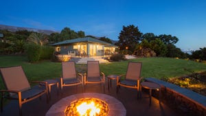 Luxury backyard fire pit at sunset