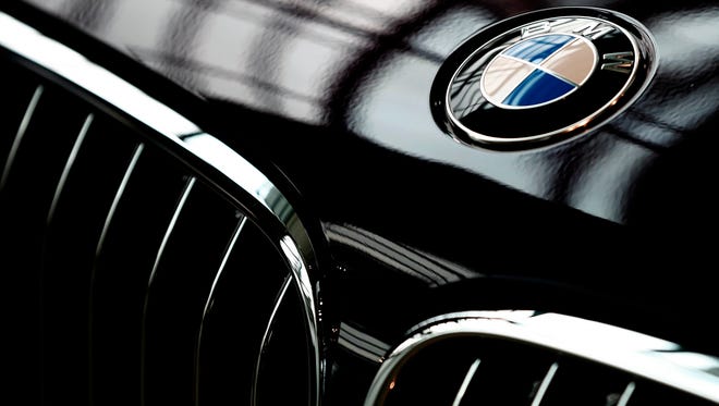 The logo of German car manufacturer BMW is pictured in Munich, Germany. Automaker BMW said Monday July 9, 2018, it will have to raise prices on the U.S.-built SUVs it sells in China due to 40 percent import tax on cars from the United States,  in retaliation for higher tariffs on Chinese goods imposed by President Donald Trump.