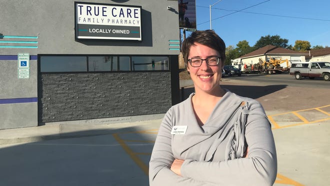 True Care Family Pharmacy owner Lindsey Osterkamp poses for a portrait in front of her business. Osterkamp opened her store last week and hopes to create a "hometown" pharmacy feeling.