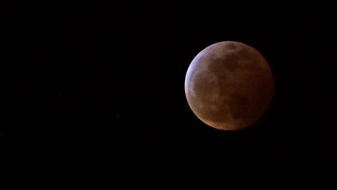 The Super Blood Wolf Moon eclipse is seen Monday, Jan. 21, 2019, in Valrico, Fla.