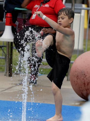 Alexander Guevara, 7, from Florida,   plays in the children's splash pad during Summerfest, Wednesday, July 5, 2017. Milwaukee Journal Sentinel Photo by Rick Wood/RWOOD@JOURNALSENTINEL.COM