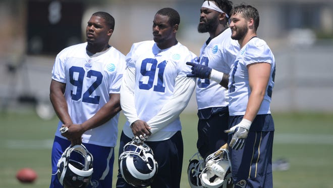 Defensive linemen Tanzel Smart (92), Dominique Easley (91), Morgan Fox  Michael Brockers pose during OTAs. Easley tore his ACL and is out for the season, adding the depth problems on what has been an anchor for the Rams the past few seasons.