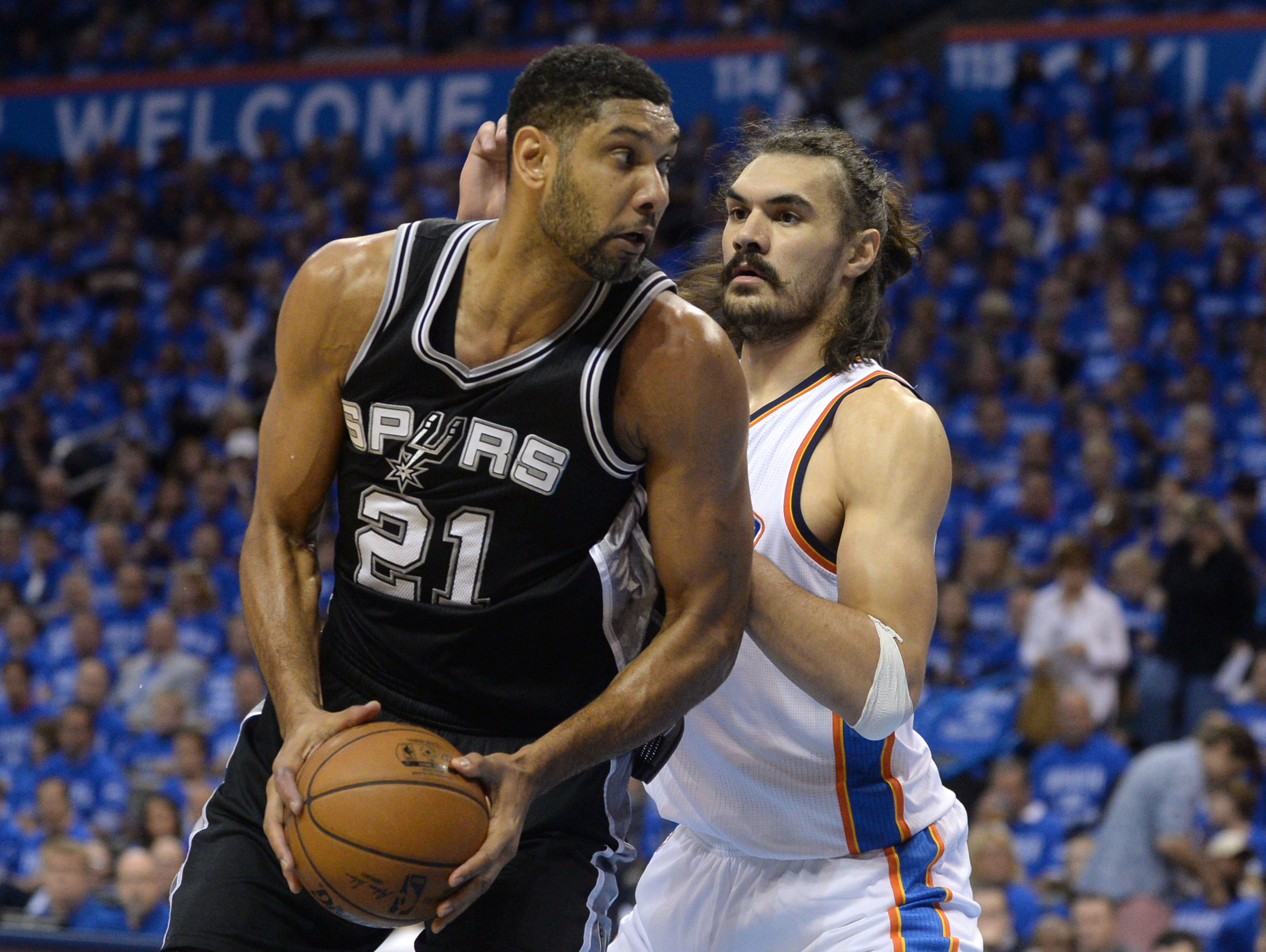 San Antonio Spurs center Tim Duncan (21) fights for position with Oklahoma City Thunder center Steven Adams (12) during the first quarter in Game 6.