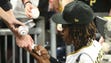 Pirates second baseman Gift Ngoepe signs autographs