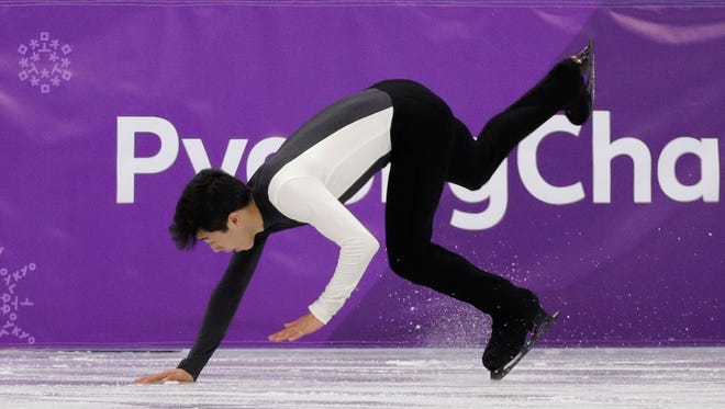American figure skater Nathan Chen falls while performing during the men's short program in the Gangneung Ice Arena at the 2018 Winter Olympics on Friday.