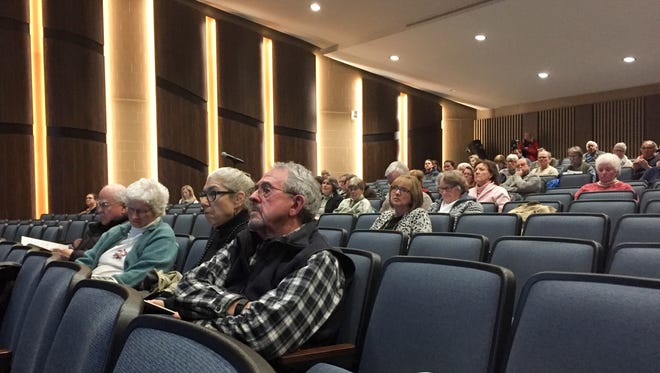 Colchester voters listen to a presentation during the town's annual meeting on Monday, March 6, 2017.