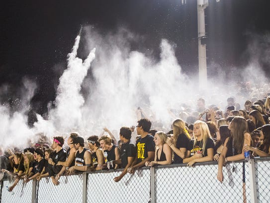 Students throw chalk in the air during the 2014 Ahwatukee