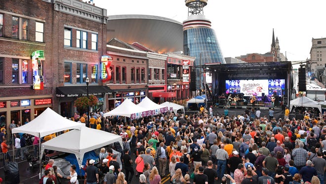 The crowd packs Lower Broadway for the Tootsie's Birthday Bash Tuesday, Oct. 10, 2017 in Nashville, Tenn. 