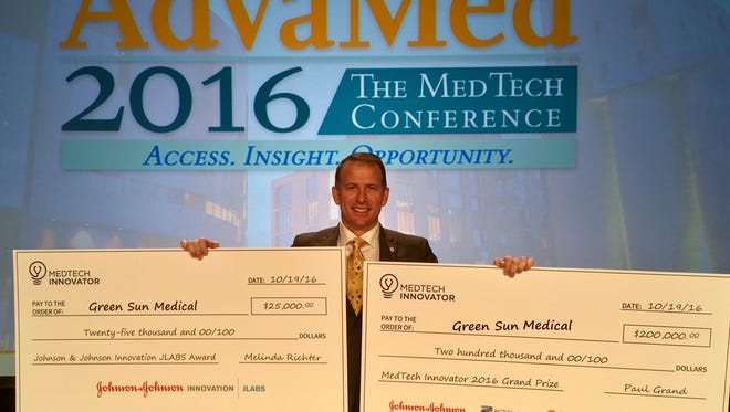 Green Sun Medical founder and CEO Jamie Haggard is pictured with winnings from the MedTech Innovator global competition held Oct. 19 in Minneapolis.