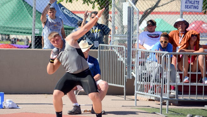 Onate's Forest McKee pivots in the 6A state boys shot put Saturday in Albuquerque. McKee won that event throwing 57 feet, 2 3/4 inches.