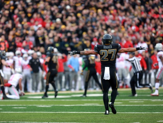 Iowa's Amani Hooker celebrates a stop during the Hawkeyes'