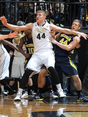 Purdue center Isaac Haas, 7-foot-2 and 297 pounds, battles for post position during a 64-51 win over Michigan. Haas and A.J. Hammons (7-0, 261) post a daunting inside challenge for opponents. Purdue and Iowa meet at 11:06 a.m. on Saturday.