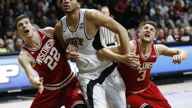 A.J. Hammons battles Ethan Happ and Zak Showalter of Wisconsin for rebounding position Sunday, March 6, 2016, at Mackey Arena. Purdue defeated Wisconsin 91-80.