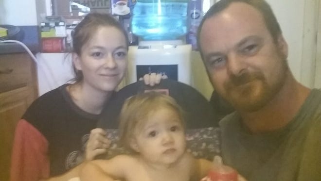 James Cobo (right) lost his job after posting a threat to Trump protesters on social media. In this photo he is with his daughter (left) and granddaughter.