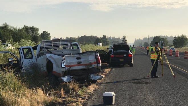 Two highway workers were injured in a hit-and-run crash early Tuesday that closed two lanes of I-5.