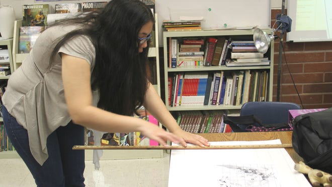 A student worked on her art project in art class during Virgin Valley High School's Fine Arts Week.