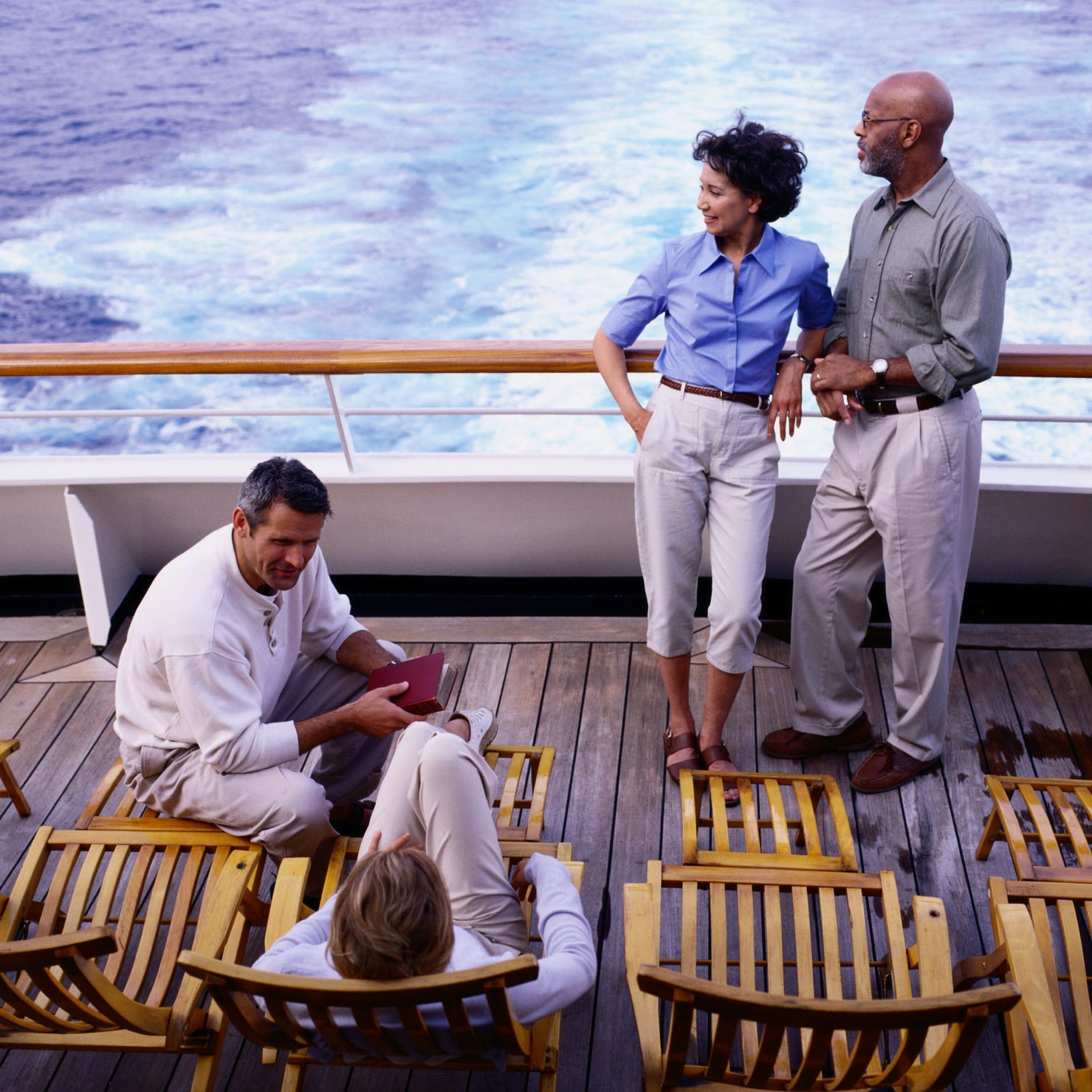 Couples on deck of cruise ship.
