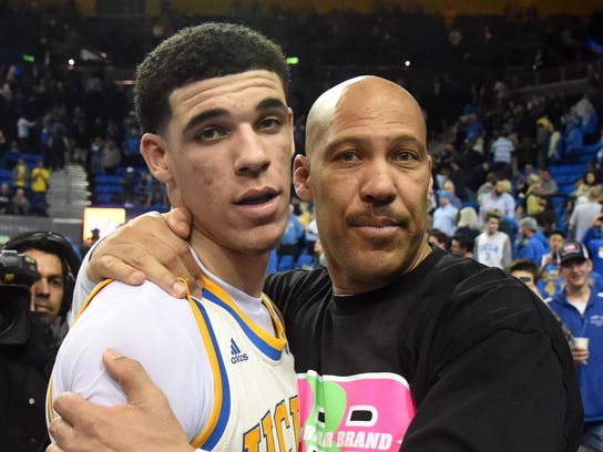 Lavar Ball embraces his son Lonzo Ball after a UCLA