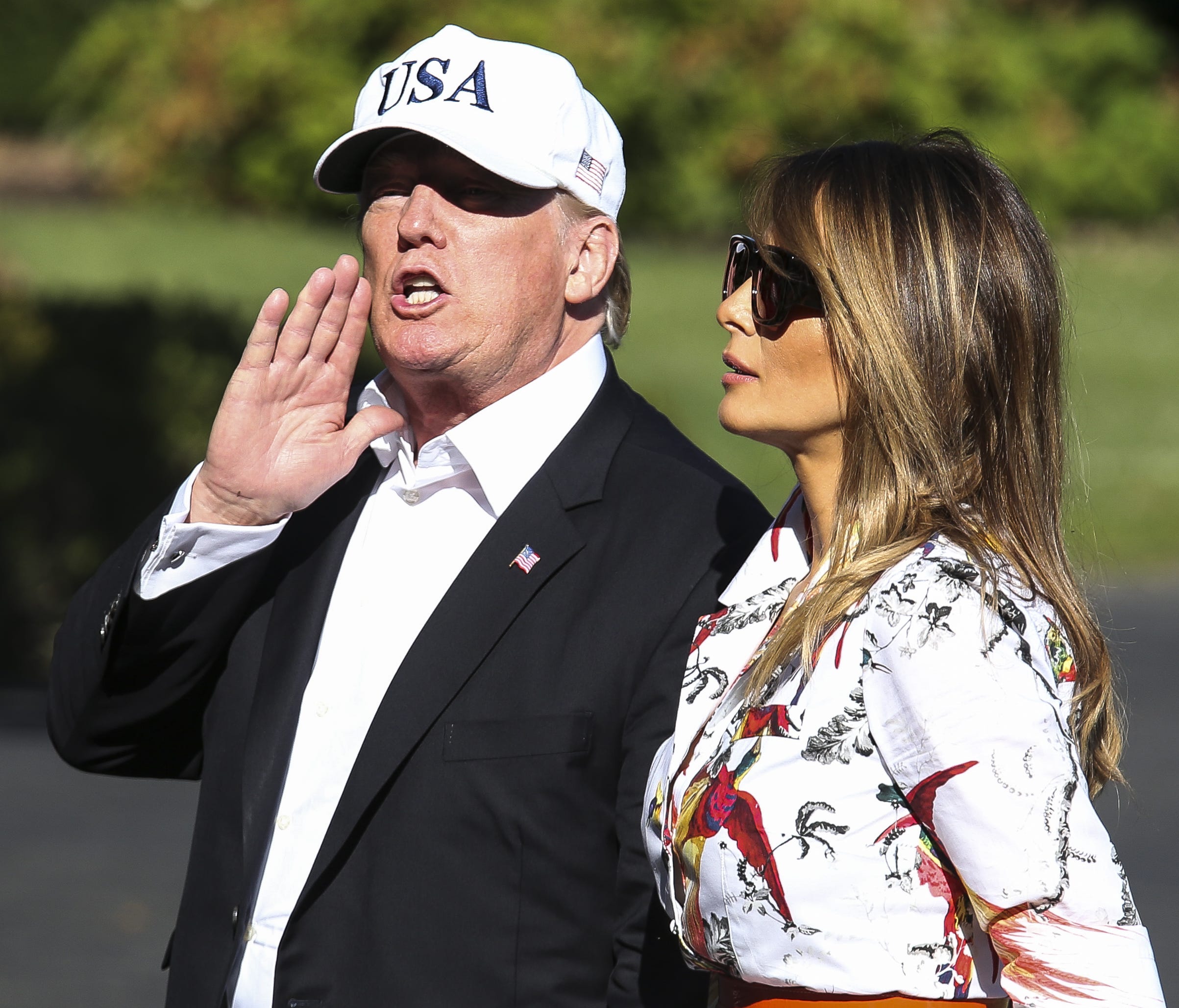 President Donald Trump and first lady Melania Trump cross the South Lawn upon arrival at the White House on July 8, 2018 in Washington, D.C.