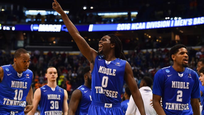 Middle Tennessee Blue Raiders players celebrate after the game against the against the Michigan State Spartans in the first round in the 2016 NCAA Tournament at Scottrade Center. Middle Tennessee State won 90-81.
