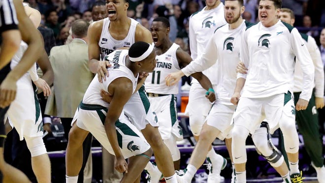 Michigan State Michigan State guard Cassius Winston, left, celebrates with guard/forward Miles Bridges after scoring a basket during the second half of an NCAA college basketball game against Northwestern, Saturday, Feb. 17, 2018, in Rosemont, Ill. Michigan State won 65-60. (AP Photo/Nam Y. Huh)