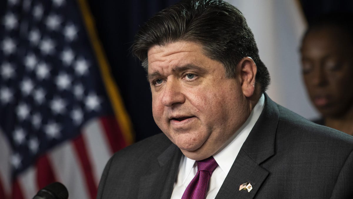 FILE - In this March 30, 2020 file photo, Illinois Gov. J.B. Pritzker speaks at the Thompson Center in Chicago during the daily update on the state's response to the coronavirus pandemic. Pritzker on March 31, 2020, extended his statewide stay-at-home order for three weeks as the nation struggles to contain the spread of the coronavirus. Pritzker set a new deadline of April 30 for keeping people inside except for essential needs and jobs.