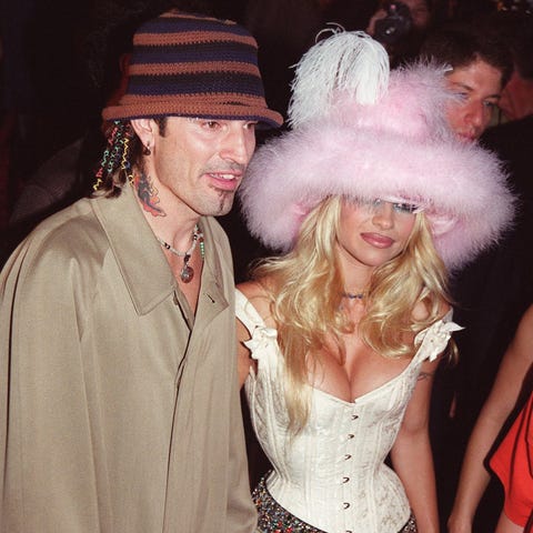 Rock musician Tommy Lee (L) and his wife actress...