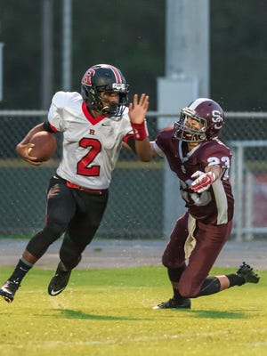 Rossview freshman Fred Orr turns the corner on a running play against Station Camp Friday in Gallatin.