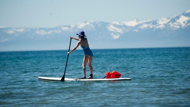Jean Crouch of Palo Alto, California, navigates a paddleboard in Lake Tahoe during the summer of 2011.