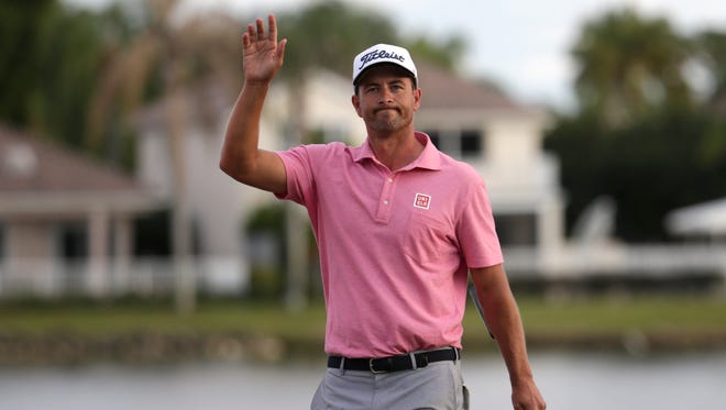Adam Scott waves to the crowd after winning the Honda Classic golf tournament at 9-under par, Sunday, Feb. 28, 2016, in Palm Beach Gardens, Fla.