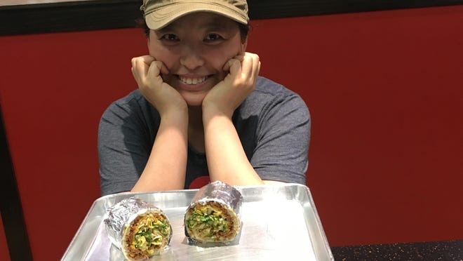 Chef Suni Kim beams over her favorite dish at Red Sesame: a pork burrito.