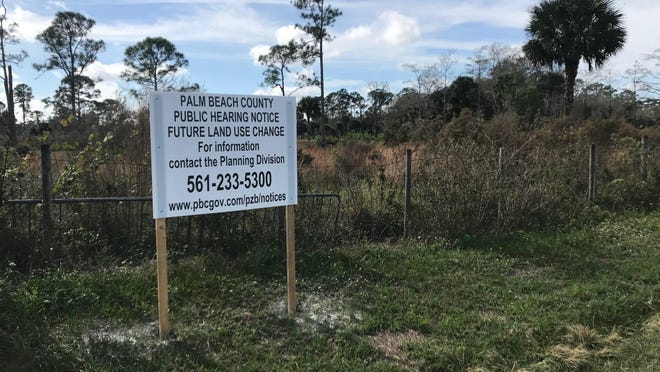 A planning and zoning notification is posted Friday at 17770 112th Drive North in Jupiter Farms. A multi-field, indoor-outdoor soccer facility is proposed for the 19.5-acre property.