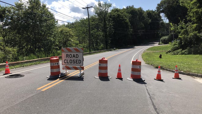 Glen Road in Sparta is seen blocked off at the intersection with Waters Edge Drive due to damage from Tropical Storm Isaias on Wednesday.