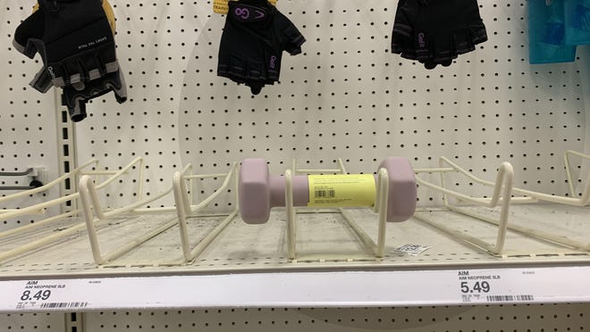A lone dumbbell awaits a buyer at a Columbus area Target store. Target and other retailers are having trouble stocking exercise equipment, disinfecting wipes and sprays, paper towels, bikes and other items during the coronavirus pandemic.