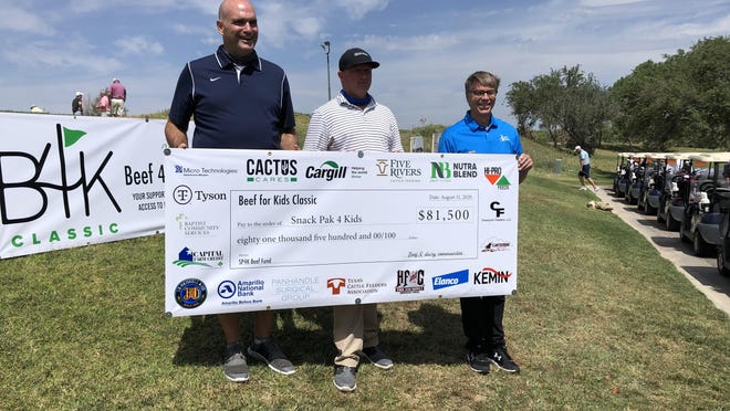 Representatives from the Texas Cattle Feeders Association, Cactus Cares and Nutriblend present a $81,500 check to Dyron Howell (far right) at the Beef 4 Kids Classic golf tournament Monday.