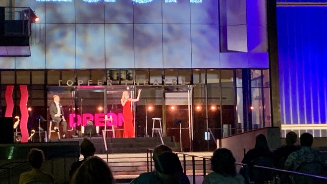 Matthew Redden and Jill Blackwood perform show tunes with a small band on the steps of the Topfer Theatre for the first installment of Zach Theatre's "Songs Under the Stars," its first in-person live show since February.