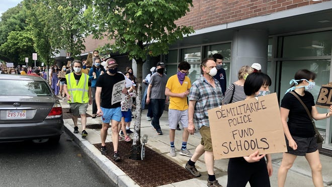 On June 6, protesters marched down Route 9 from the Old Lincoln School, then up Washington Street to the Public Library of Brookline, just across from the Brookline police station.