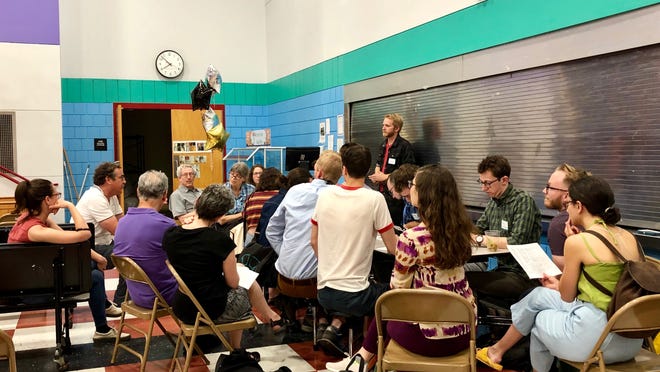 At a June 12, 2019 meeting, residents gather to talk about volunteering and fundraising for the Somerville CLT.
