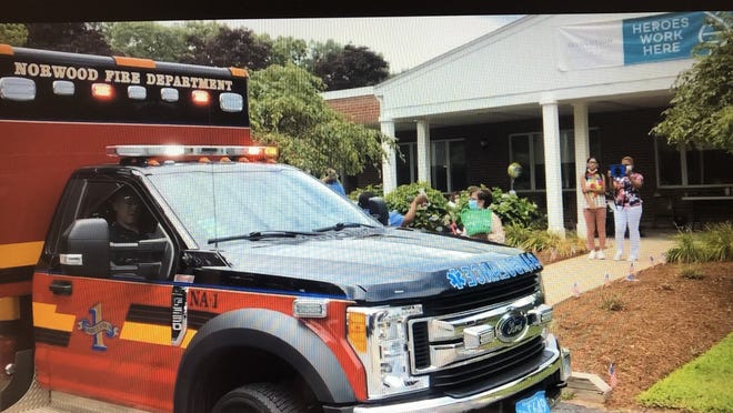 A Norwood Fire ambulance stops by Revolution Charwell for a grab-and-go barbecue lunch, part of the facility's celebration on July 23.