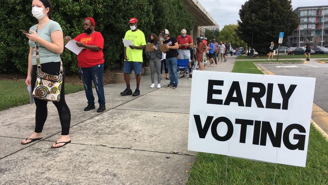 The line stretched across the eastern facade of the Civic Center on Monday morning as early voting started.