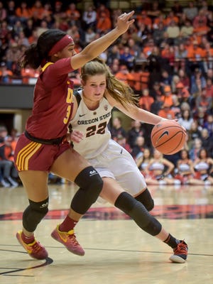 Oregon State's Kat Tudor, right, drives past Southern California's Minyon Moore in the first half of an NCAA college basketball game in Corvallis, Ore., Sunday, Feb. 18, 2018.
