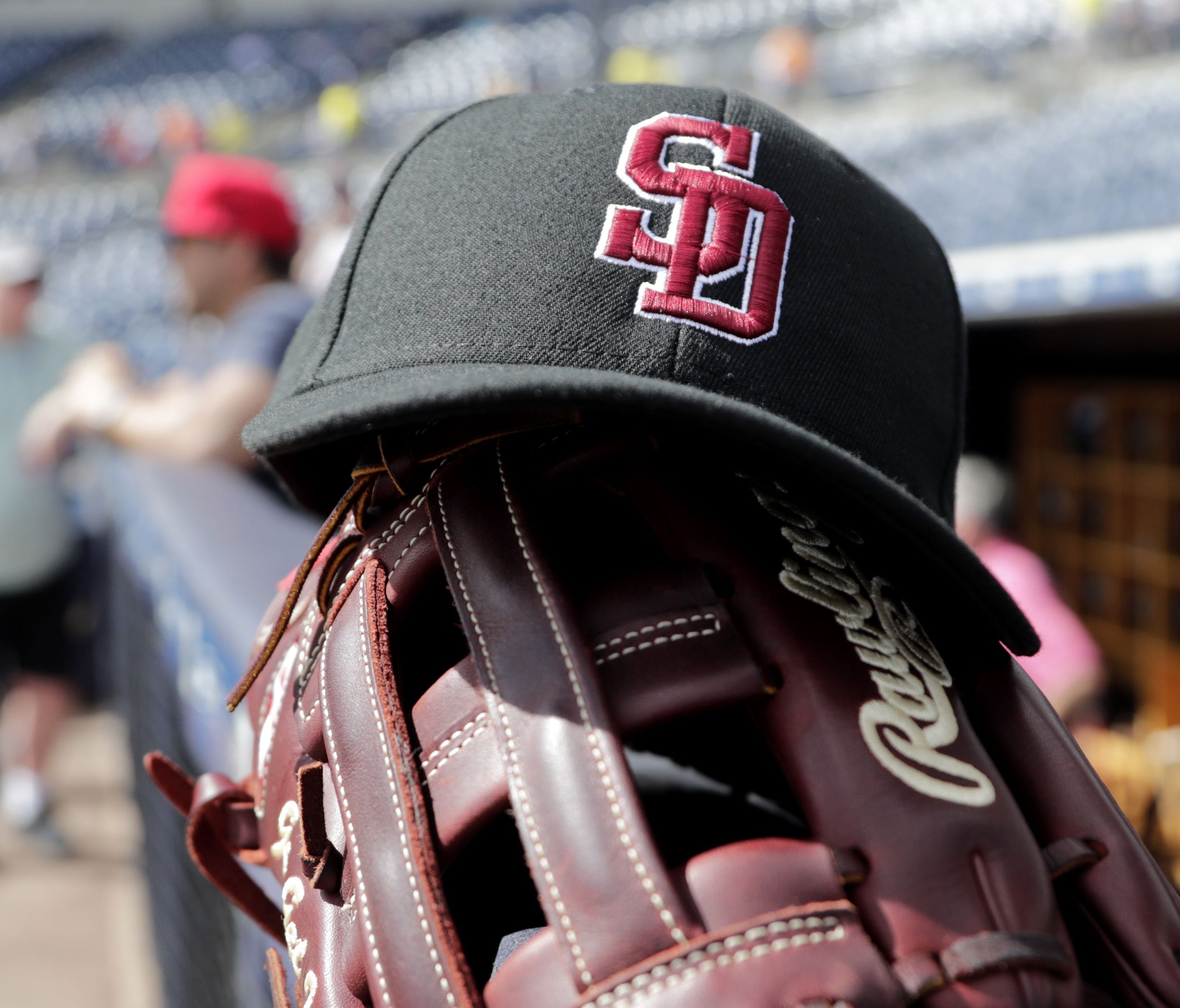 A hat which honors the victims of a mass shooting at Marjory Stoneman Douglas High School sits on the dugout at a spring training baseball game between the New York Yankees and Detroit Tigers.